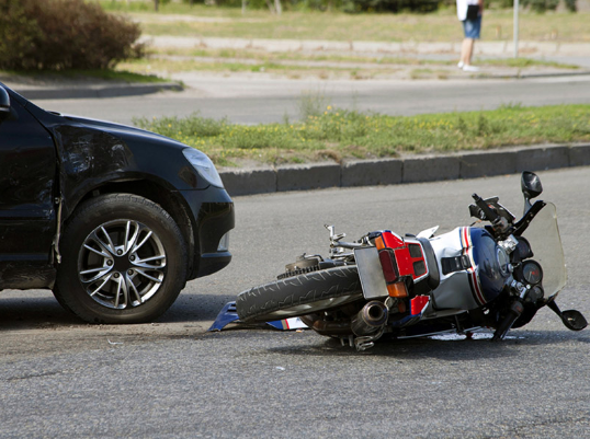 Accident with a motorcycle and a car peaceful photo